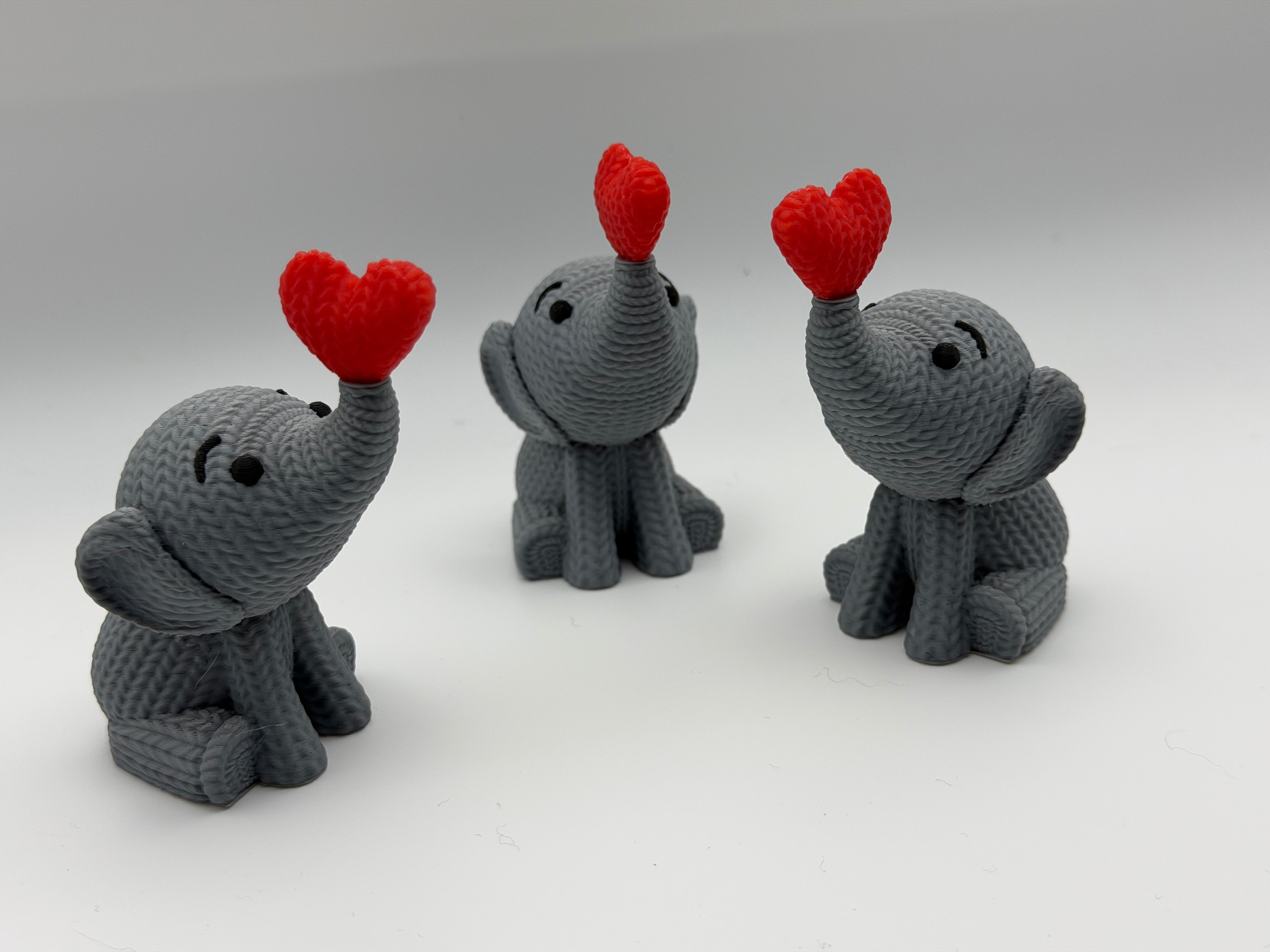 Cute Knitted effect Valentines Elephant sitting with heart on end of trunk