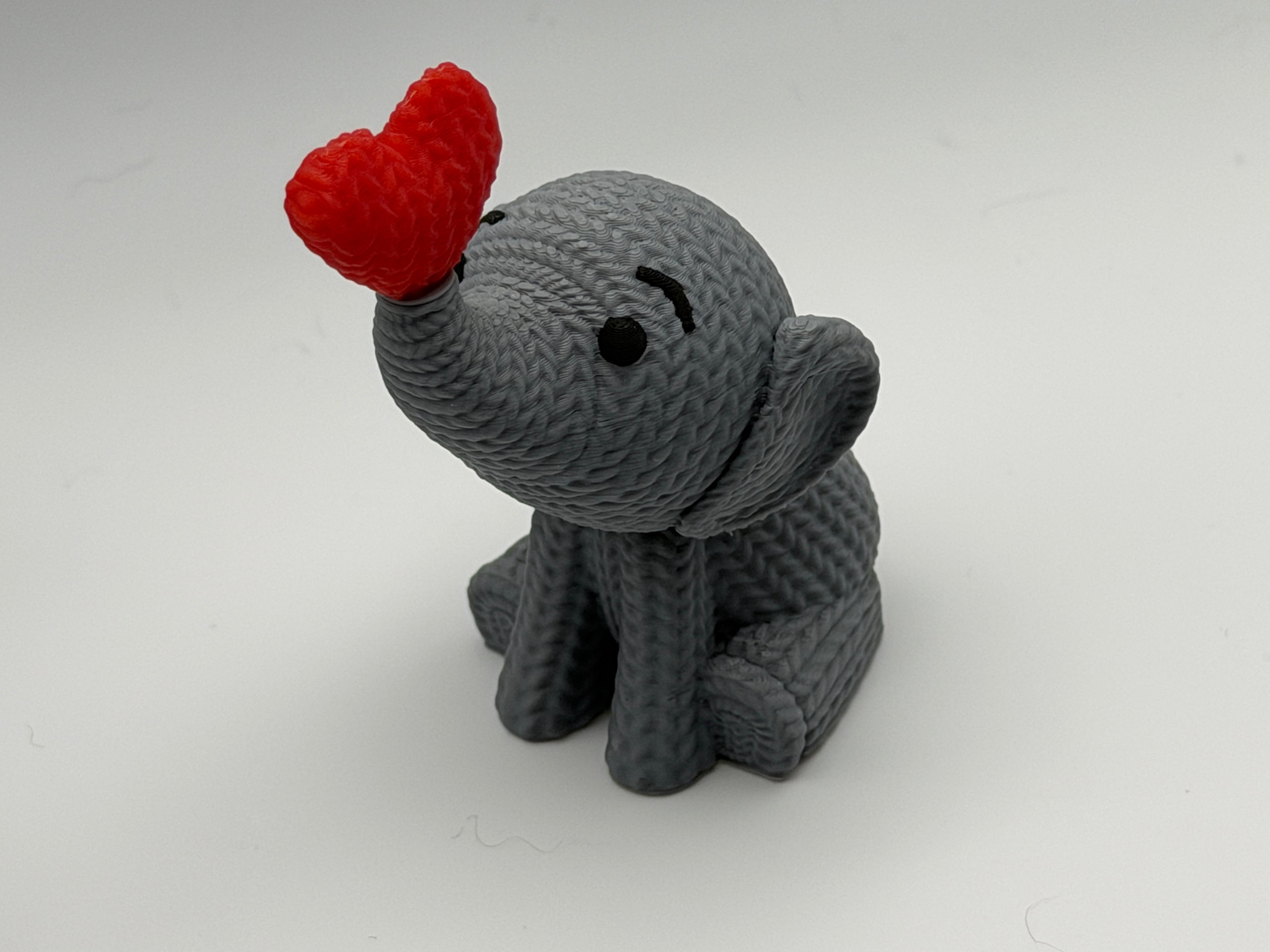 Cute Knitted effect Valentines Elephant sitting with heart on end of trunk