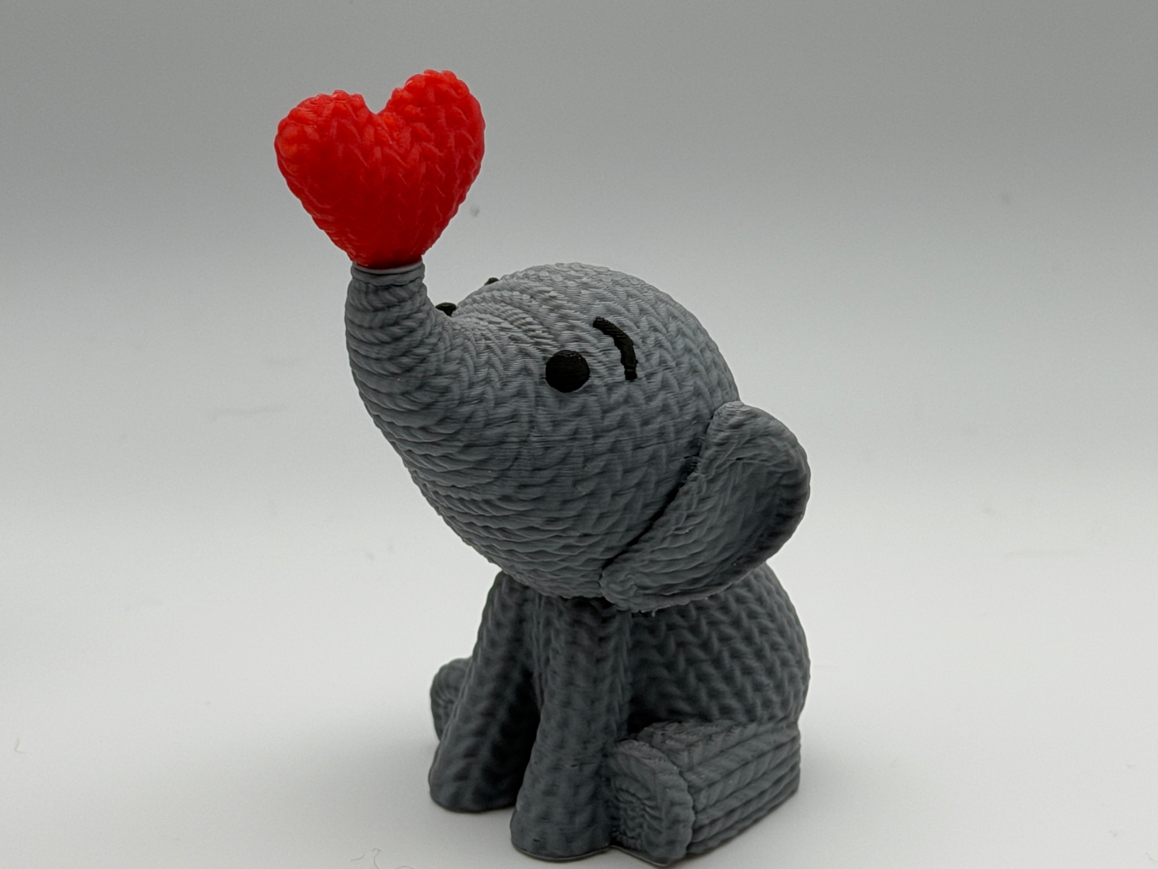 Cute Knitted effect Valentines Elephant sitting with heart on end of trunk