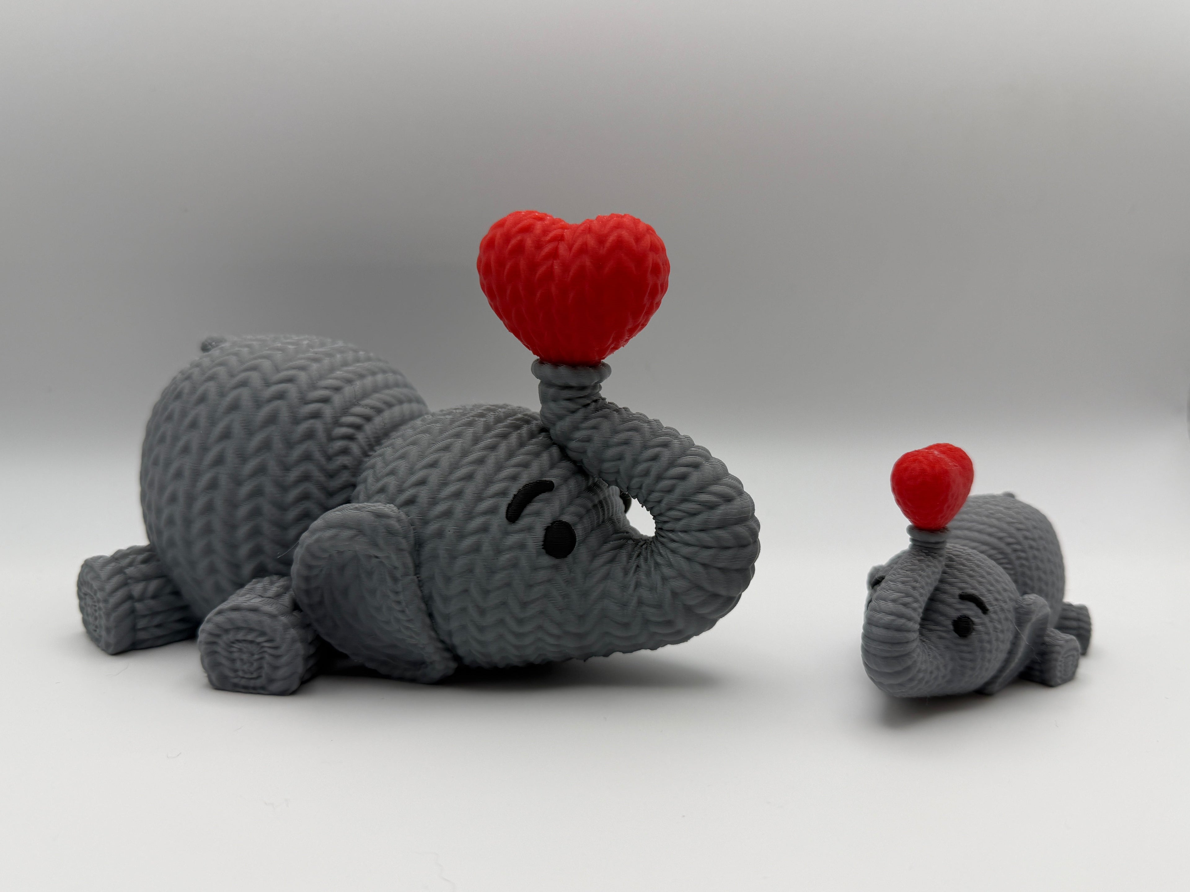 Cute Knitted effect Valentines Elephant lying down with heart on end of trunk